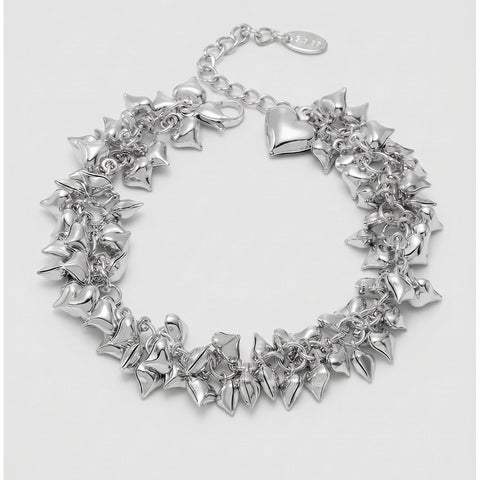 Silver heart-shaped bracelet on a light gray background