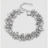 Silver heart-shaped bracelet on a light gray background