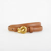 Brown leather belt with a gold knot buckle on a white background